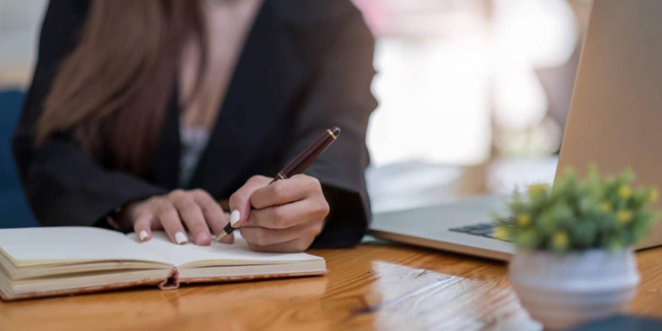 Theatre workshop with scripts and notebooks scattered on wooden table
